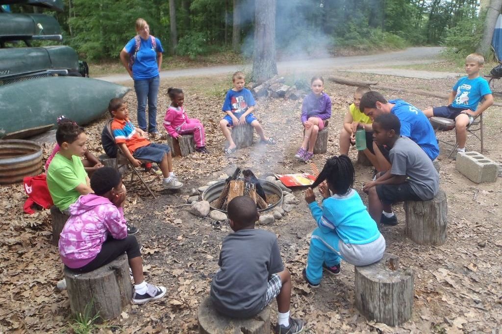 Campers gathered around a campfire
